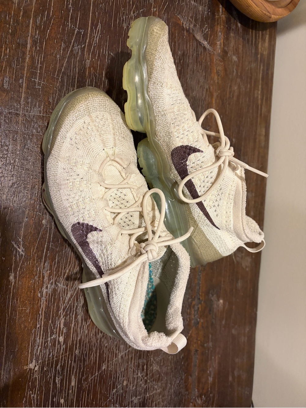 Nike Men’s Cream Flyknit Sneakers with Purple Swoosh
